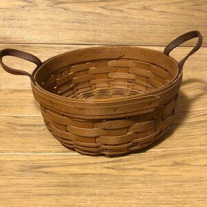 Longaberger basket dated 1995 and signed basket with two side leather handles